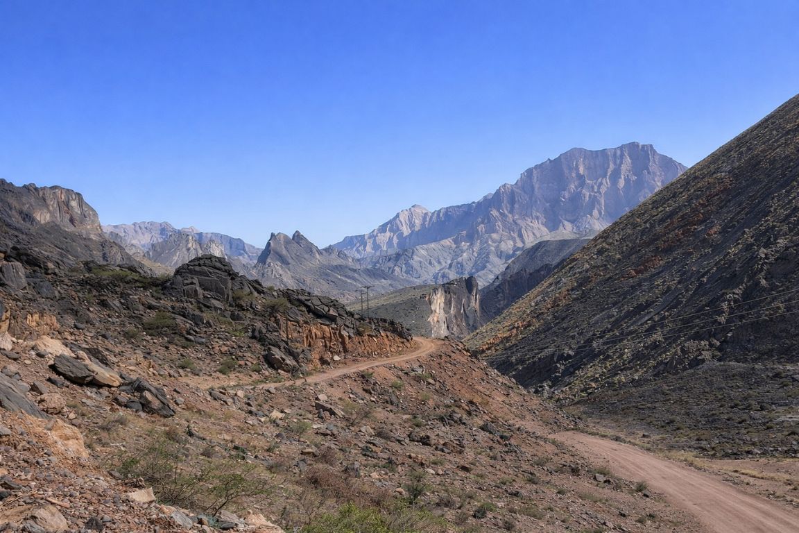 Natural beauty of the Hajar Mountains with dramatic rock formations seen during a tour with Oman Muscat Tours