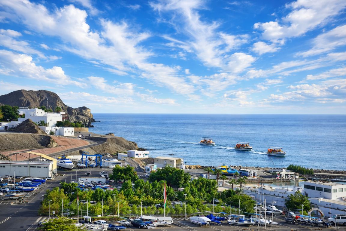 Marina Bandar Al Rowdha in Muscat with boats heading into the sea during a tour with Oman Muscat Tours